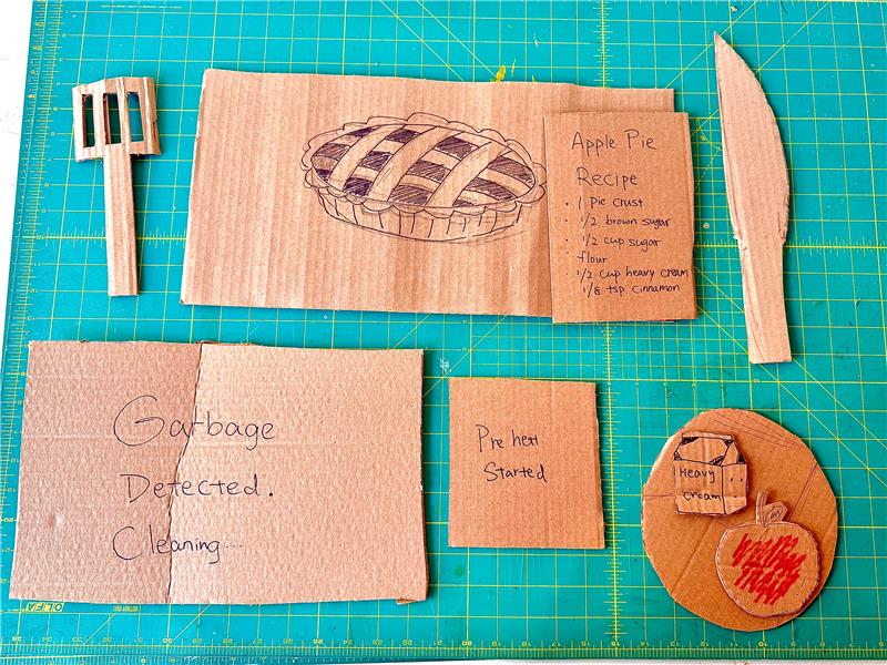 We created prototypes to complete the challenge, the tools includes recipe card, ingredients, and cooking tools to support the apple pie scenario. The smart kitchen can help users by giving instructions to the user.